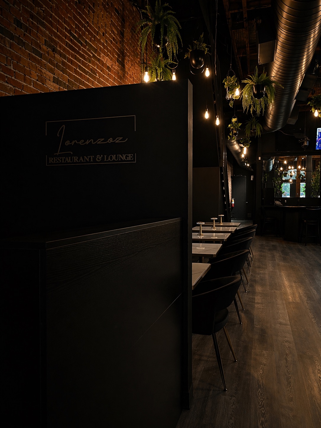 Lorenzoz Restaurant & Lounge interior with warm lighting and brick walls
